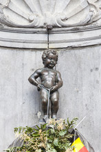 Manneken Pis Statue In The Centre Of Brussels.