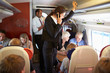 © Monkey Business - Businesswoman Using Mobile Phone On Busy Commuter Train