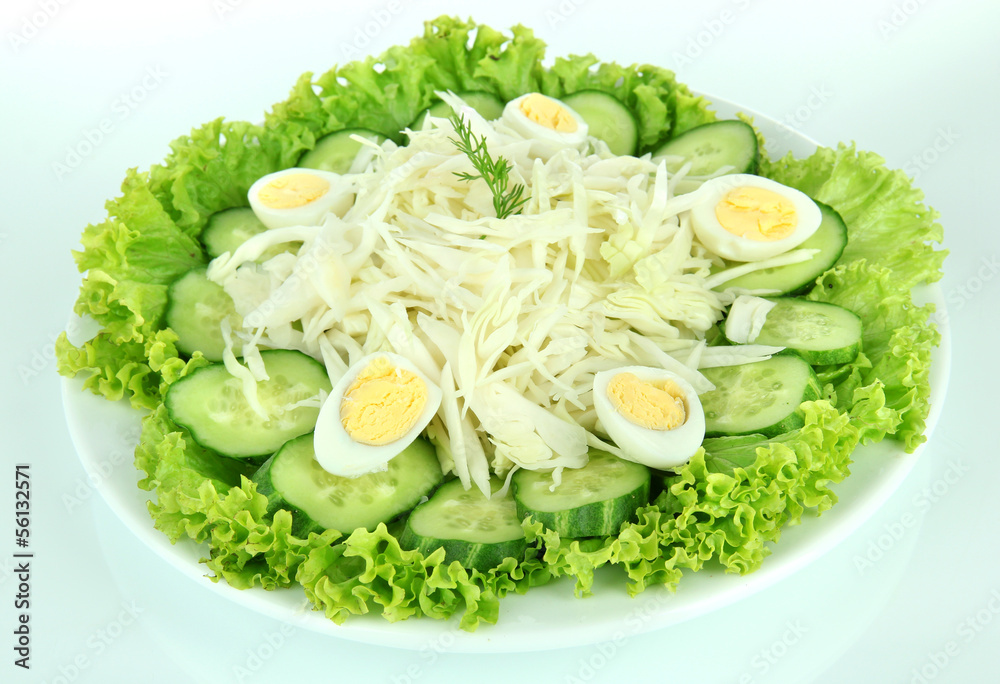 Delicious salad with eggs, cabbage and cucumbers, isolated