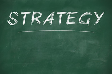 Wall Mural - strategy written on a chalkboard