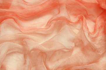 Peach chaotic draped fabric
