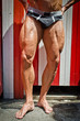 © theartofphoto - Close-up of muscular legs outdoors