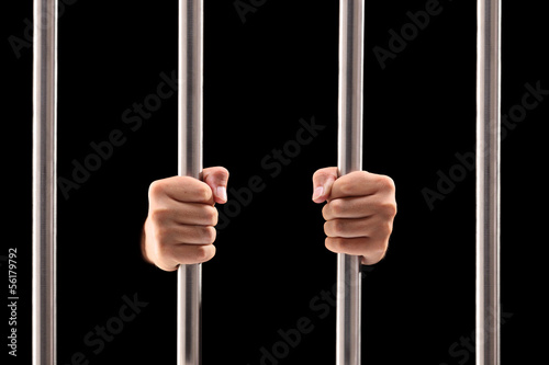 Fotografia, Obraz  Male hands holding prison bars