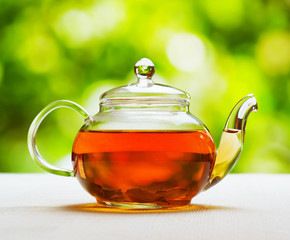 Wall Mural - Teapot of fresh tea on natural background