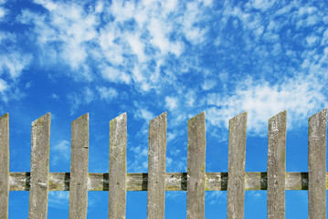 Wall Mural - old wooden fence with cloudy sky