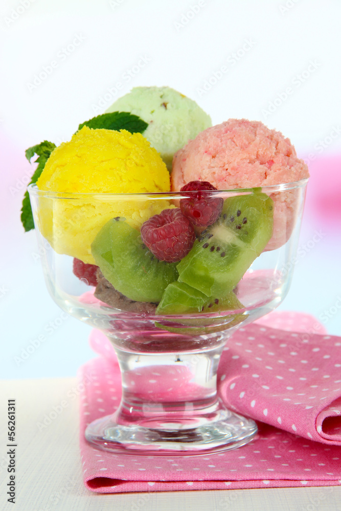 Tasty ice cream scoops, wooden on table