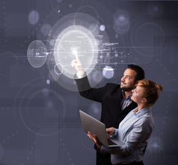 Poster - Happy couple touching abstract high technology circular buttons
