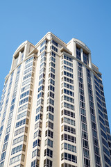 Sticker - White Condo Tower Under Blue Skies