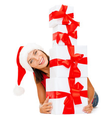 smiling woman in santa helper hat with gift boxes