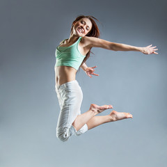 beauty girl dance on grey background