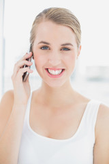 Wall Mural - Close up on happy sporty woman having a phone call