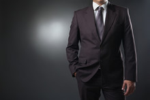 Businessman In Suit On Gray Background