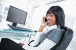 © lightwavemedia - Smiling businesswoman on the phone