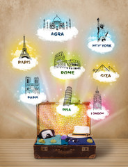 Wall Mural - Tourist suitcase with famous landmarks around the world