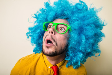 Wall Mural - crazy funny young man with blue wig