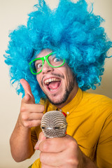 Wall Mural - crazy funny young man with blue wig