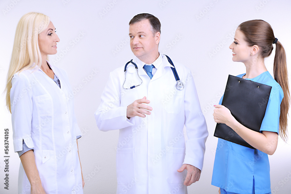 Medical workers on grey background