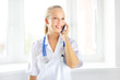 © Anton Maltsev - Female doctor talking on the cell phone