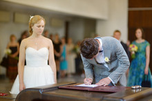 Groom Signing A Wedding Contract