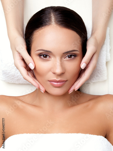Obraz na plátně Face Massage. Close-up of a Young Woman Getting Spa Treatment.