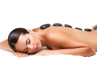 Wall Mural - Stone Massage. Beautiful Woman Getting Spa Hot Stones Massage. S