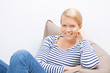 © fuchsphotography - Woman sitting on a beanbag