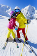 Skiing, winter - happy skiers on ski run