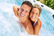 © grinny - Happy couple in jacuzzi.