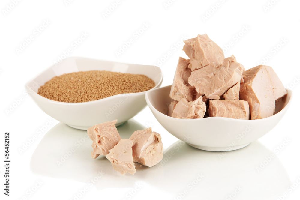 Yeast cubes in bowls isolated on white