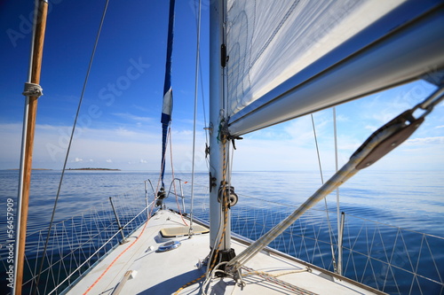 Tapeta ścienna na wymiar Sailboat yacht sailing in blue sea. Tourism