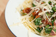 Pasta dish with spinach, bacon and parmesan