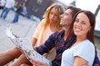 © Nejron Photo - Three friends tourist with map outdoors