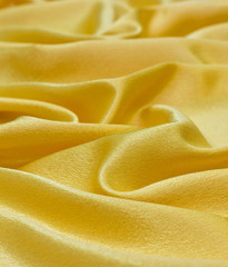drapery of golden satin fabric