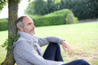 © goodluz - Senior man sitting in park and enjoying quietness