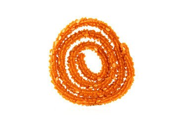 Traditional indian snack - chakali, isolated on white.