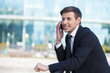 © BlueSkyImages - Successful businessman. Cheerful young men in formalwear talking