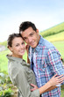 © goodluz - Portrait of sweet couple in countryside