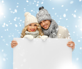 Sticker - couple in a winter clothes holding blank board