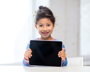 girl with tablet pc at home