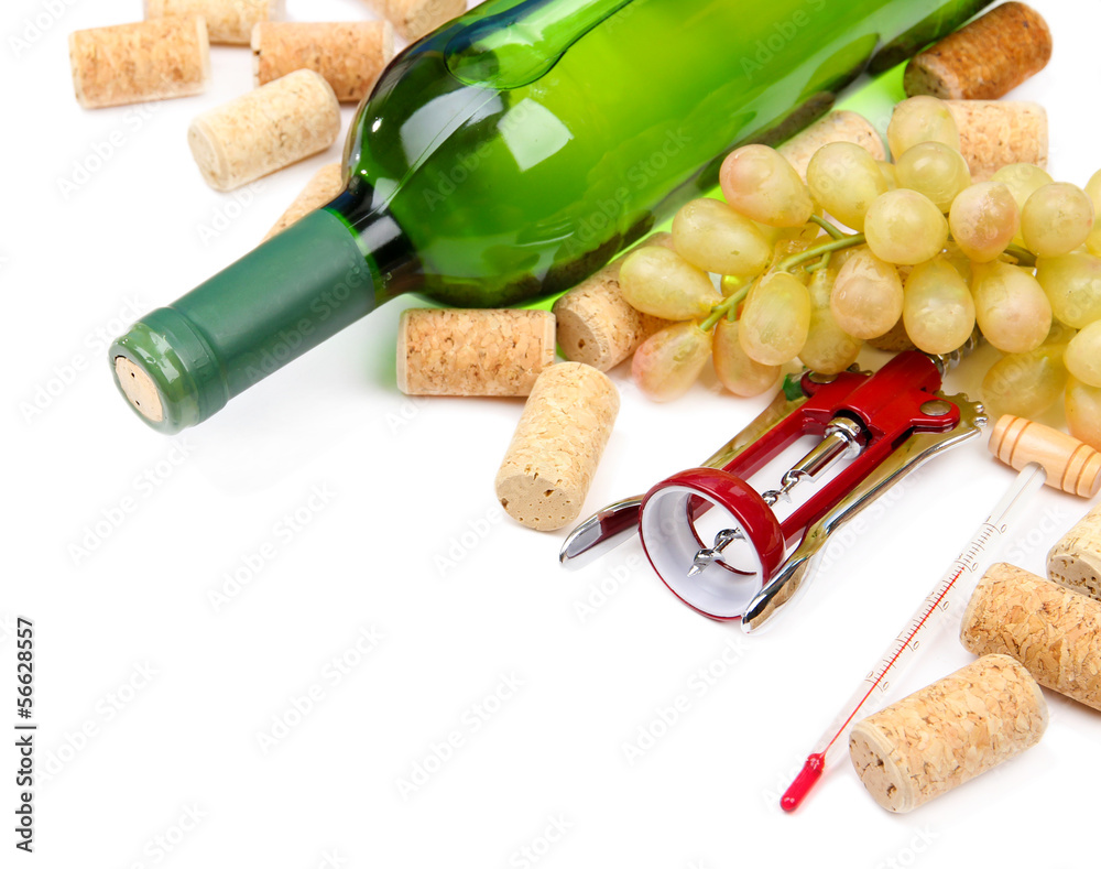 Bottle of wine, grapes and corks, isolated on white