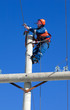electrician working on top of an electricity pylon