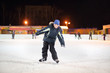 © Pavel Losevsky - Smiling boy wearing in black suit and blue hat skates