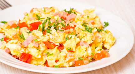 Wall Mural - scrambled eggs with ham and vegetables