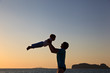 © nadezhda1906 - Father and son silhouettes at the beach