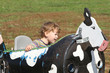 child on a farm ride hayride