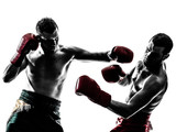 two men exercising thai boxing silhouette