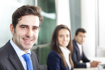 Business team smiling at the office, lined up