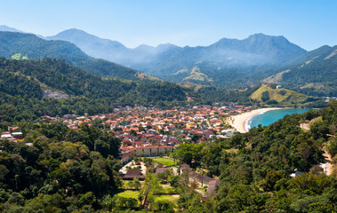 Fototapete - Resort Town near Beach surrounded by Mountains in Brazil
