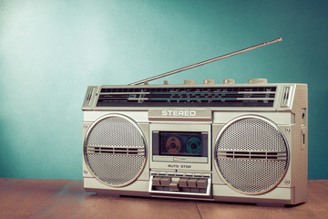 Wall Mural - retro ghetto blaster on table in front mint green background