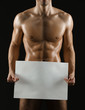 © Karramba Production - Naked sportive man hands large white sheet of paper copyspace
